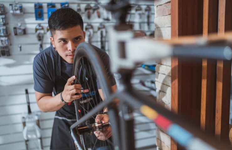 Repair technician bicycles was repaired gear bike shop.