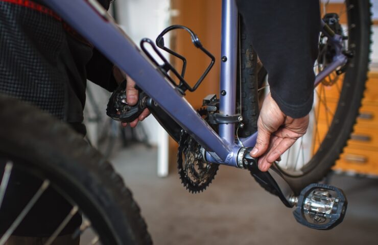 mechanic inspecting bike bottom bracket